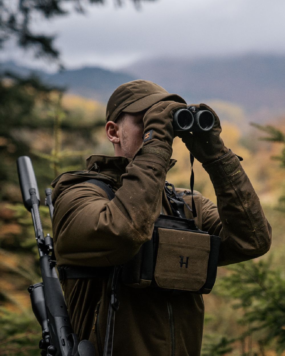 Hunting Green Shadow Brown Coloured Harkila Forest Hunter GTX Jacket on outdoor background 