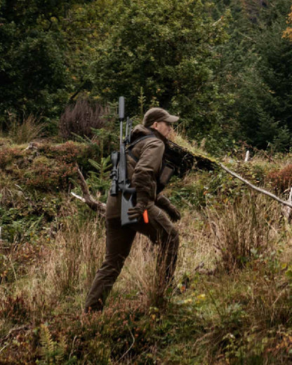 Hunting Green Shadow Brown Coloured Harkila Forest Hunter GTX Jacket on outdoor background 