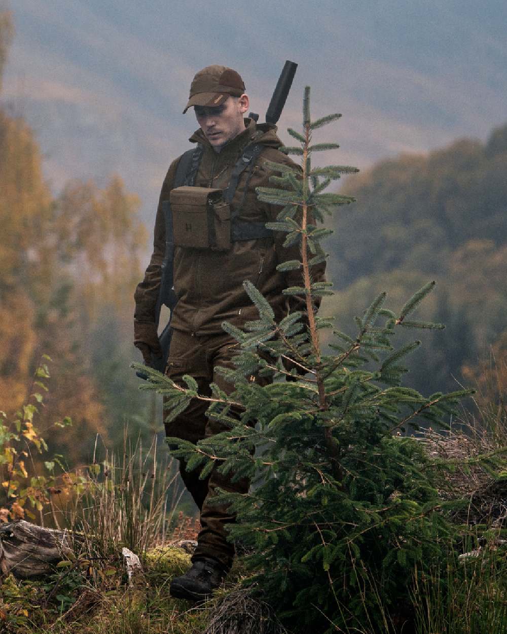 Hunting Green Shadow Brown Coloured Harkila Forest Hunter GTX Jacket on outdoor background 