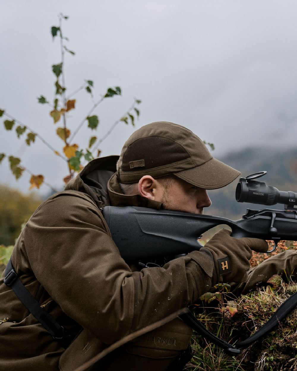 Hunting Green Shadow Brown Coloured Harkila Forest Hunter GTX Jacket on outdoor background 