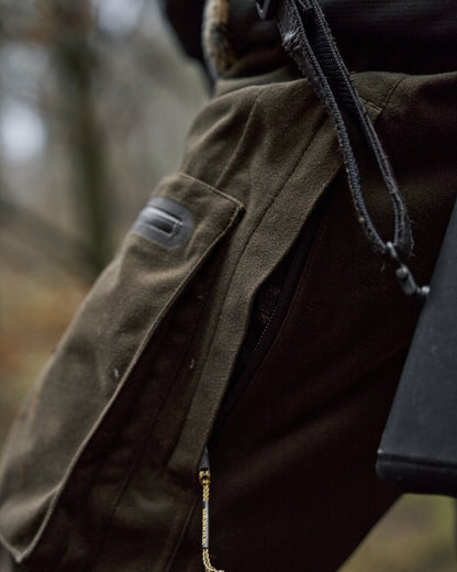 Hunting Green Shadow Brown Coloured Harkila Forest Hunter Pro GTX Trousers on outdoor background 