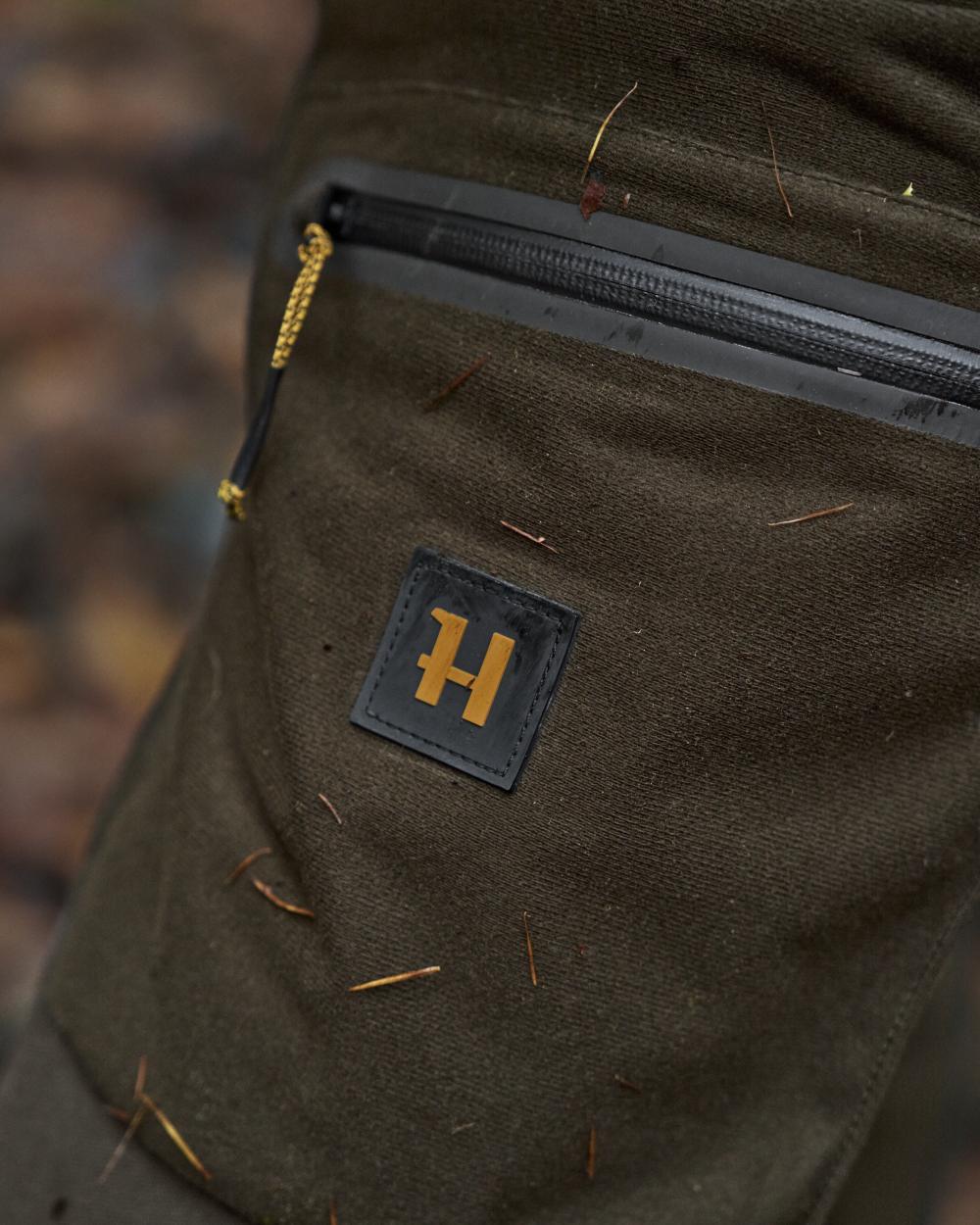 Hunting Green Shadow Brown Coloured Harkila Forest Hunter Pro GTX Trousers on outdoor background 