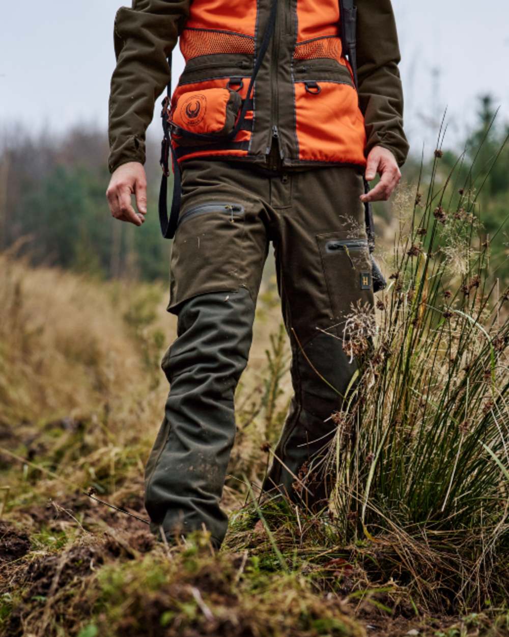 Hunting Green Shadow Brown Coloured Harkila Forest Hunter Pro GTX Trousers on outdoor background 