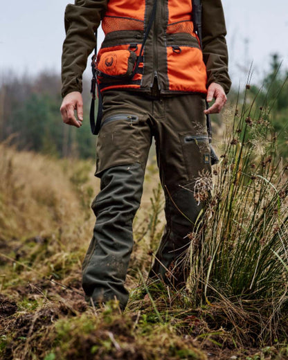 Hunting Green Shadow Brown Coloured Harkila Forest Hunter Pro GTX Trousers on outdoor background 