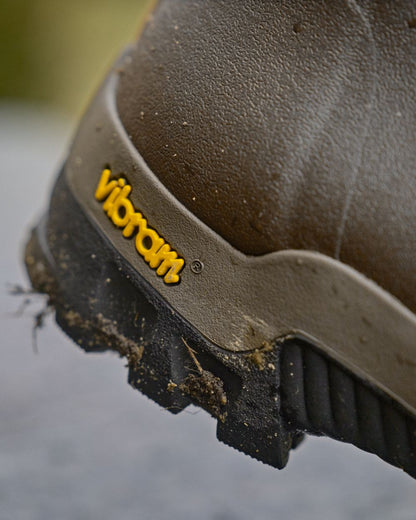 Dark Willow Green Coloured Harkila Forester Gusset Rubber Boots on outdoor background 