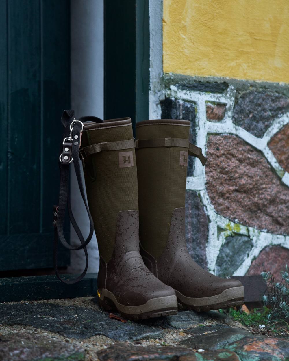 Willow Green Deep Brown Coloured Harkila Forester Zip Rubber Boot on outdoor background 