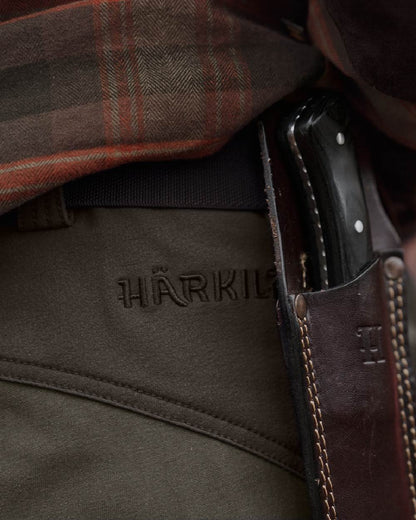 Black Olive Forest Night coloured Harkila Hill Trousers on outdoor background 