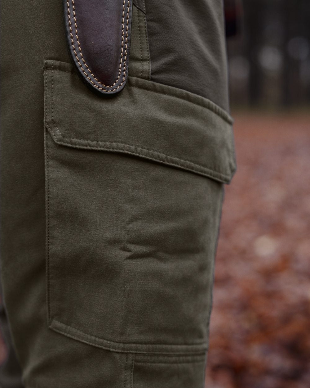 Black Olive Forest Night coloured Harkila Hill Trousers on outdoor background 