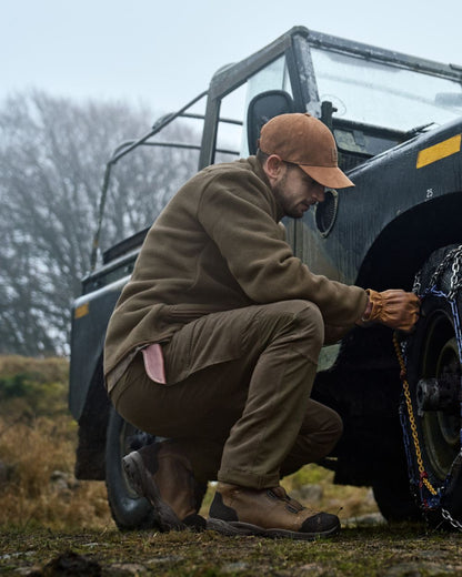 Willow Green Brown Coloured Harkila Hill Trousers on outdoor background 