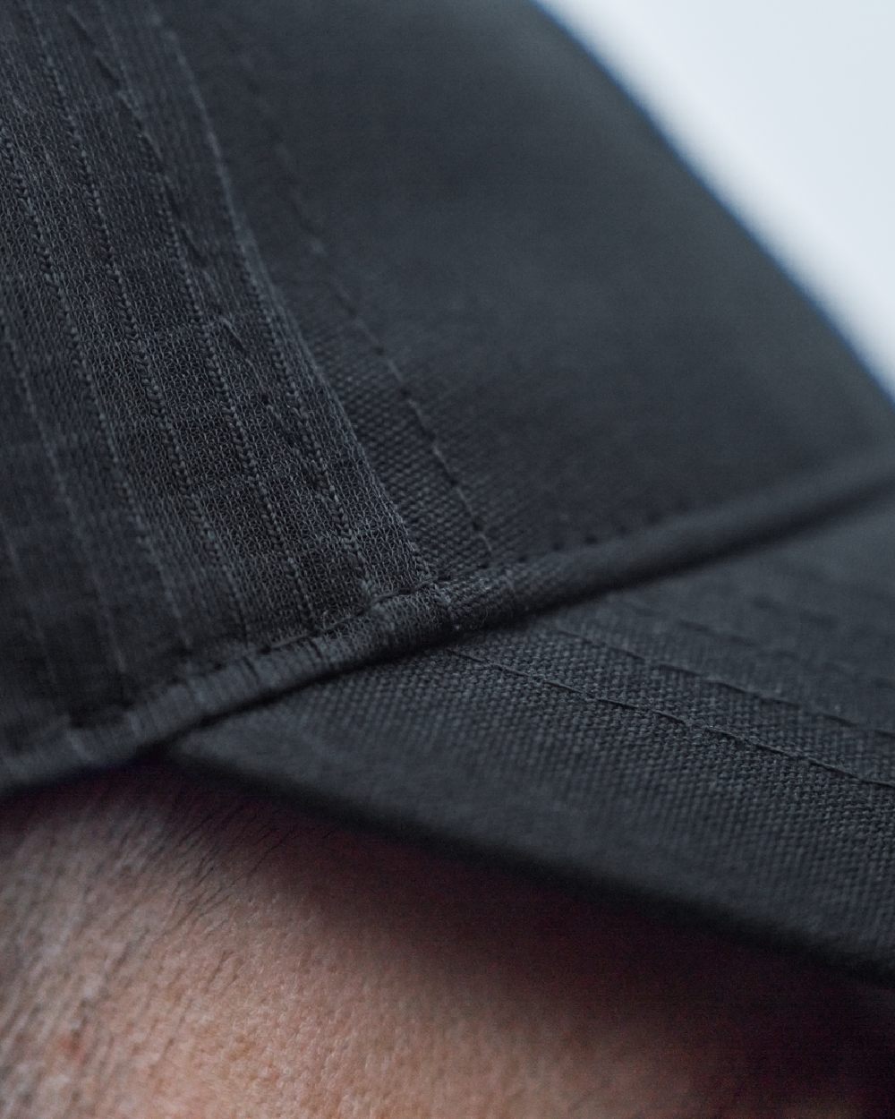Dark Navy Coloured Harkila Instinct Cap on blurry background 