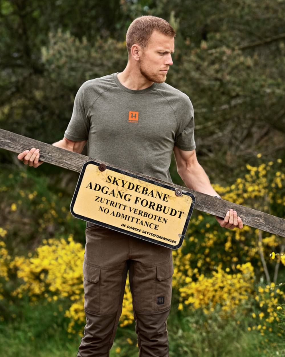 Green Melange coloured Harkila Instinct Short Sleeve T-Shirt on forest background 