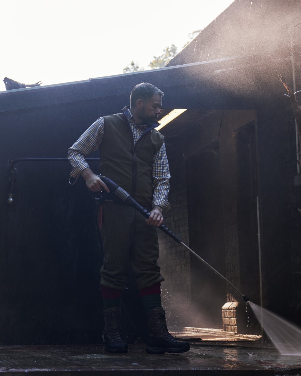 Dark Olive Sea Blue Coloured Harkila Kamko Estate WSP Reversible Waistcoat on outdoor background 