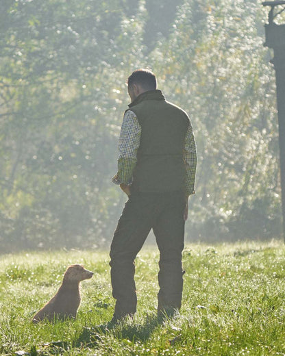 Dark Olive Sea Blue Coloured Harkila Kamko Estate WSP Reversible Waistcoat on outdoor background 