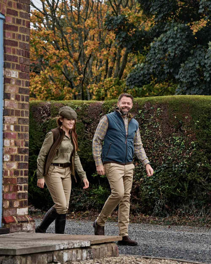 Dark Olive Sea Blue Coloured Harkila Kamko Estate WSP Reversible Waistcoat on outdoor background 