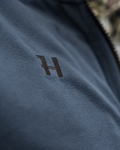 Dark Olive Sea Blue Coloured Harkila Kamko Estate WSP Reversible Waistcoat on outdoor background 