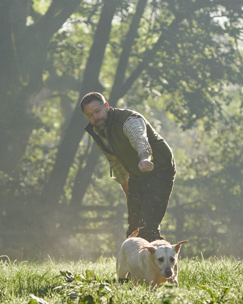 Dark Olive Sea Blue Coloured Harkila Kamko Estate WSP Reversible Waistcoat on outdoor background 