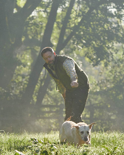 Dark Olive Sea Blue Coloured Harkila Kamko Estate WSP Reversible Waistcoat on outdoor background 