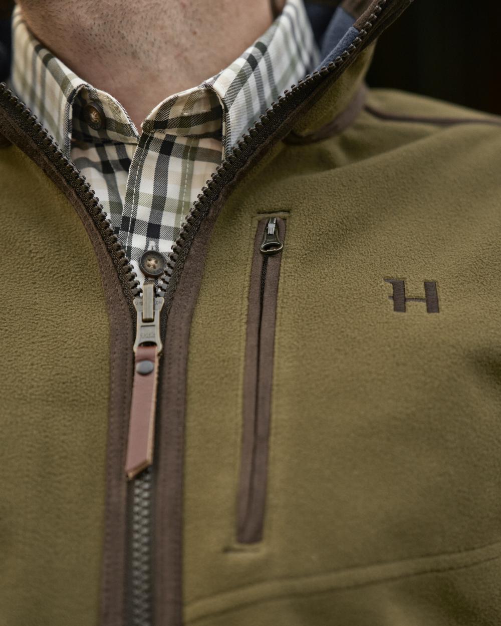 Dark Olive Sea Blue Coloured Harkila Kamko Estate WSP Reversible Waistcoat on outdoor background 