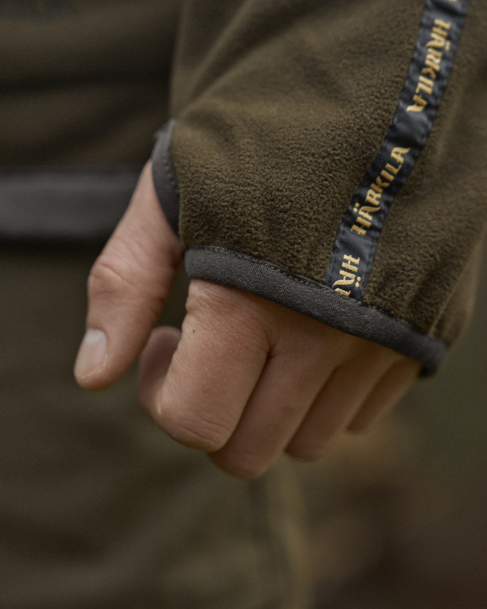 Dark Antique Bronze Willow Green Coloured Harkila Kamko Fleece on outdoor background 