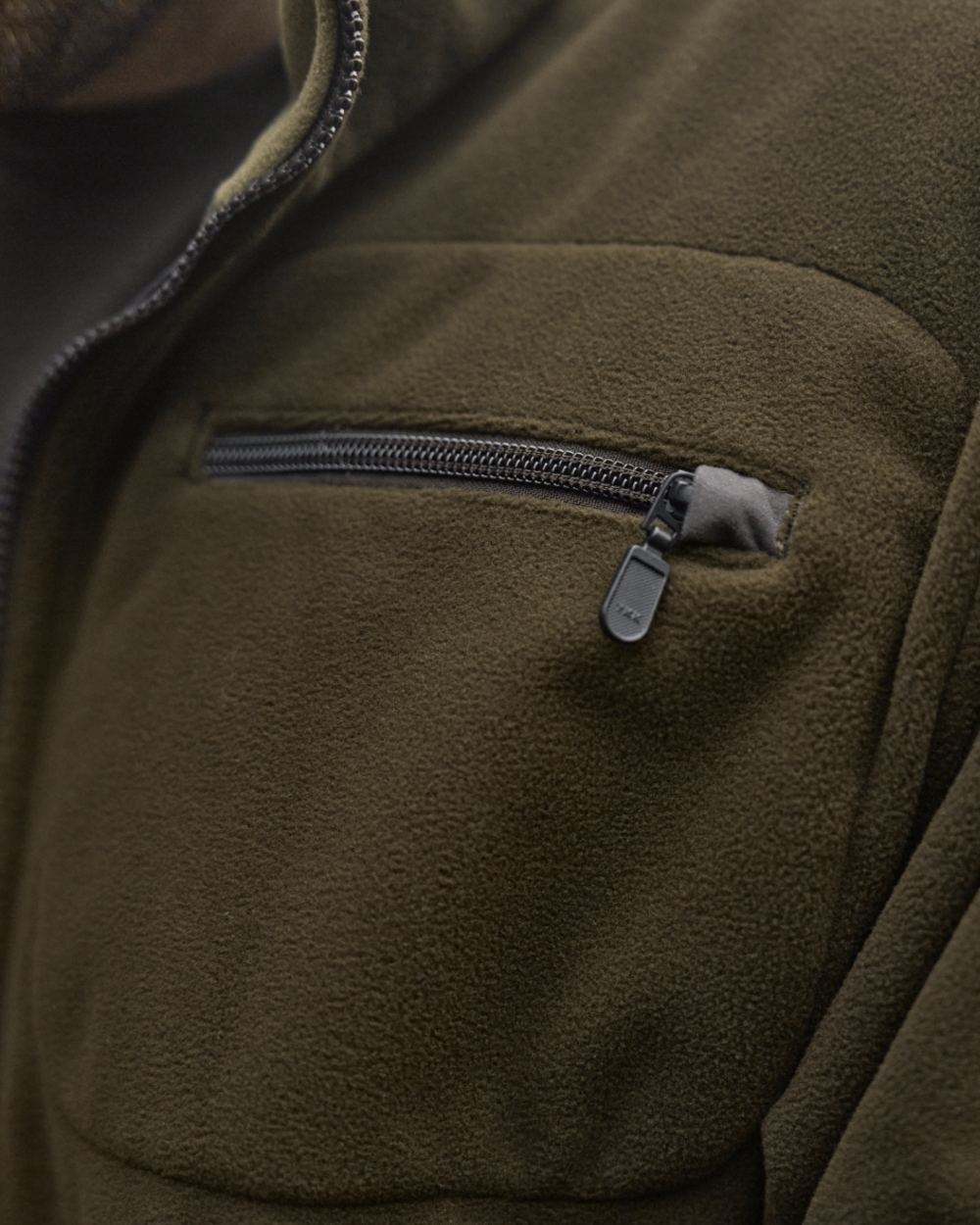 Dark Antique Bronze Willow Green Coloured Harkila Kamko Fleece on outdoor background 