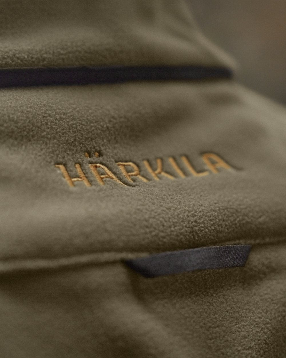 Dark Antique Bronze Willow Green Coloured Harkila Kamko Fleece on outdoor background 