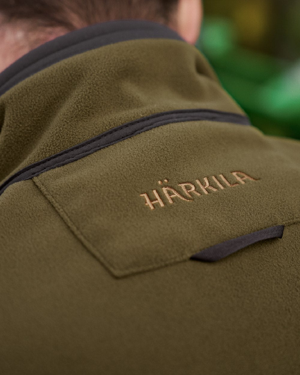 Dark Olive Arabian Spice Coloured Harkila Kamko Fleece on outdoor background 