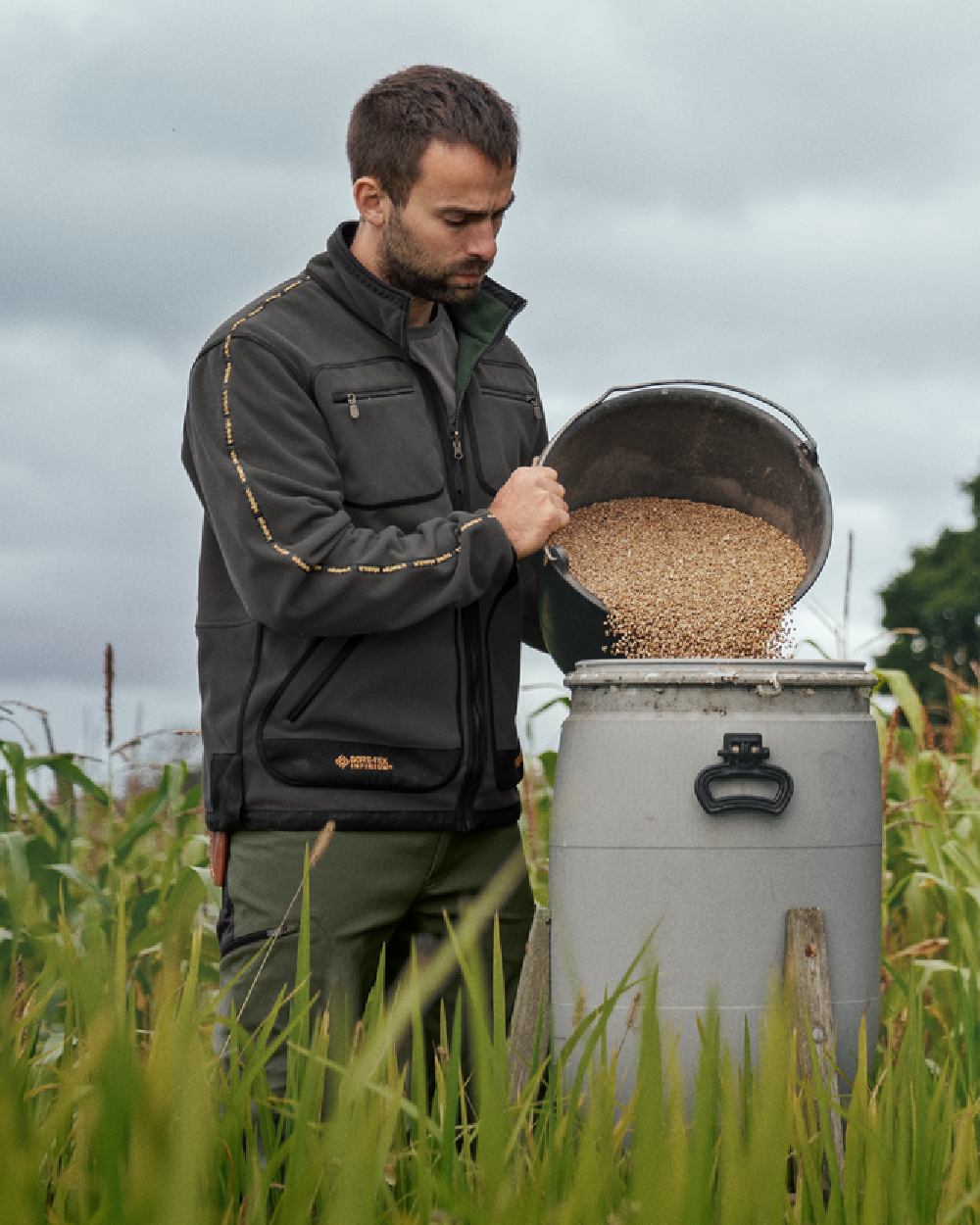 Grey Green Coloured Harkila Kamko Fleece on outdoor background 