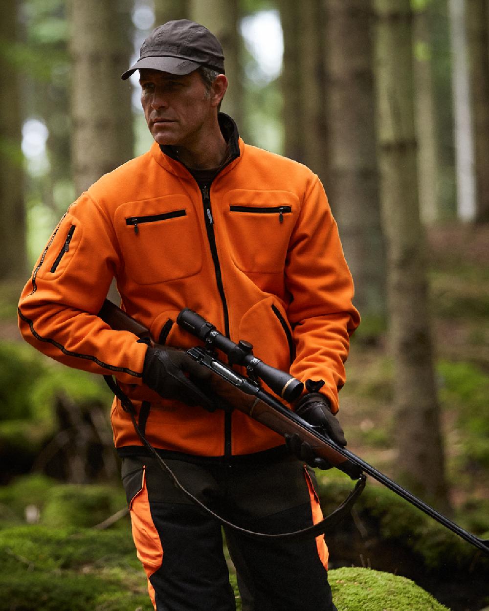 Hunting Green Orange Blaze Coloured Harkila Kamko Fleece on outdoor background 
