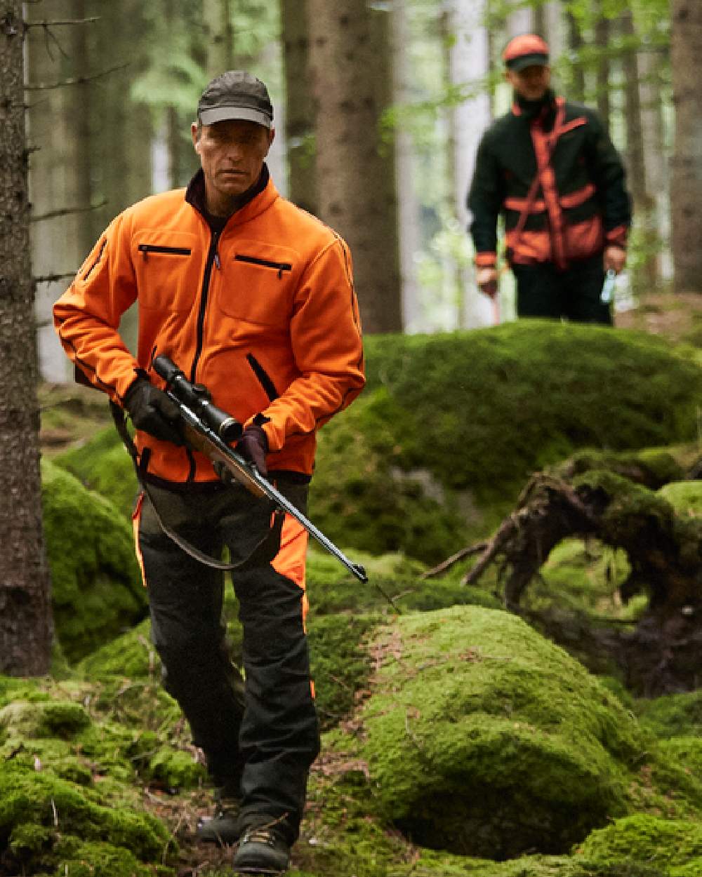 Hunting Green Orange Blaze Coloured Harkila Kamko Fleece on outdoor background 