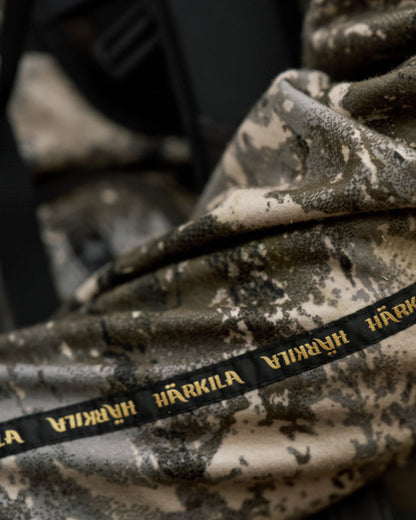 Axis MSP Mountain Shadow Brown Coloured Harkila Kamko Mountain WSP Reversible Fleece Jacket on forest background 