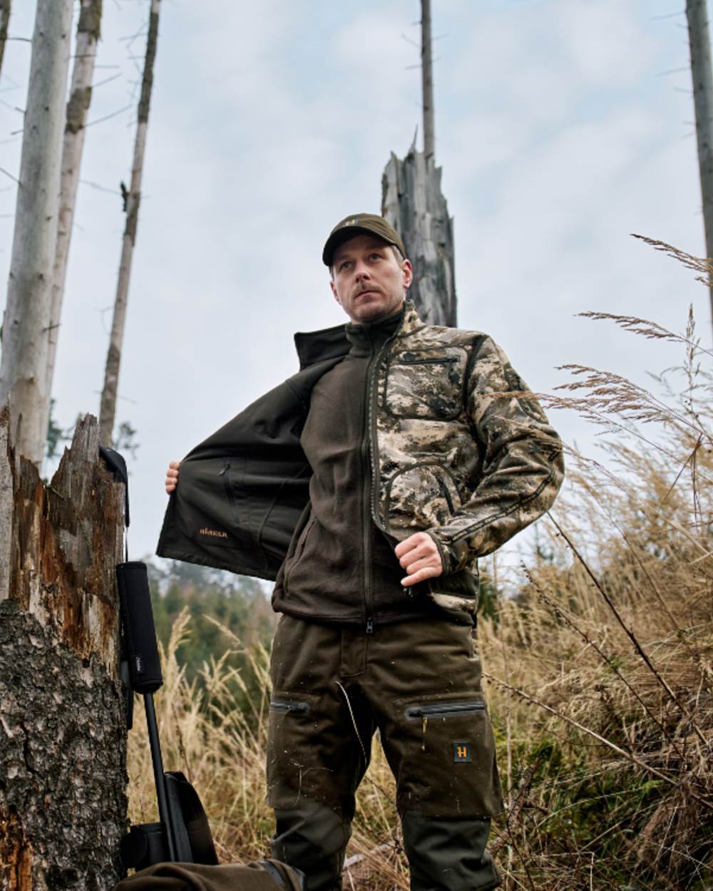 Axis MSP Mountain Shadow Brown Coloured Harkila Kamko Mountain WSP Reversible Fleece Jacket on forest background 