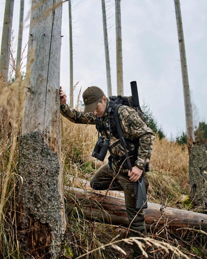 Axis MSP Mountain Shadow Brown Coloured Harkila Kamko Mountain WSP Reversible Fleece Jacket on forest background 