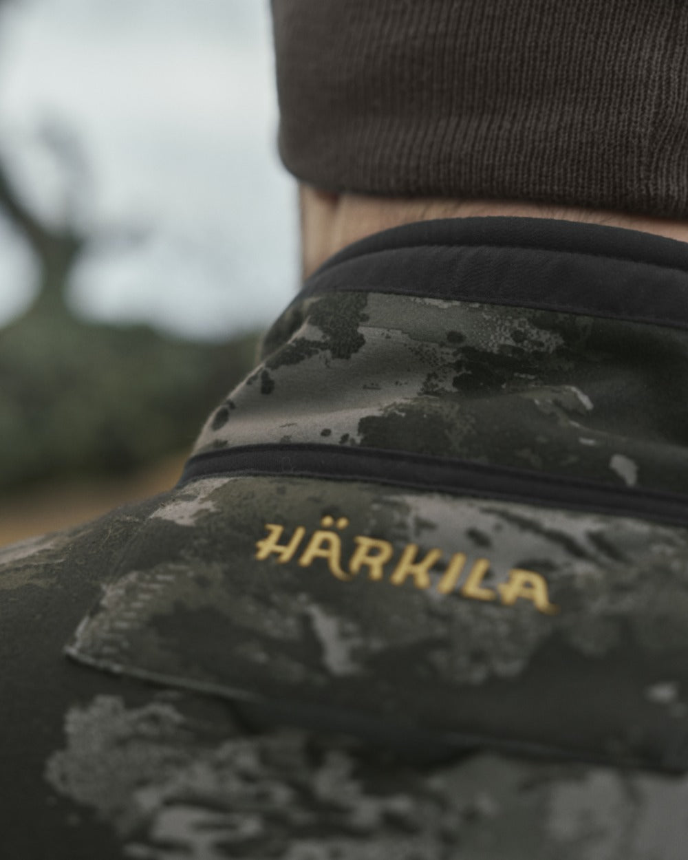 Axis MSP Black Willow Green Coloured Harkila Kamko NOCTYX WSP Reversible Fleece Jacket on outdoor background 