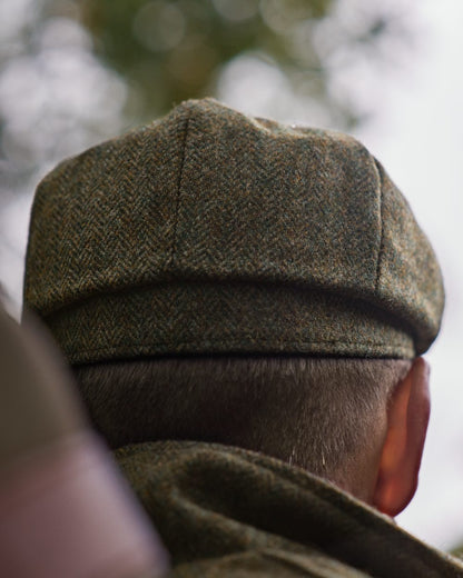Forest Green Herringbone Coloured Harkila Kenmore Classic Baker Boy Cap on forest background 