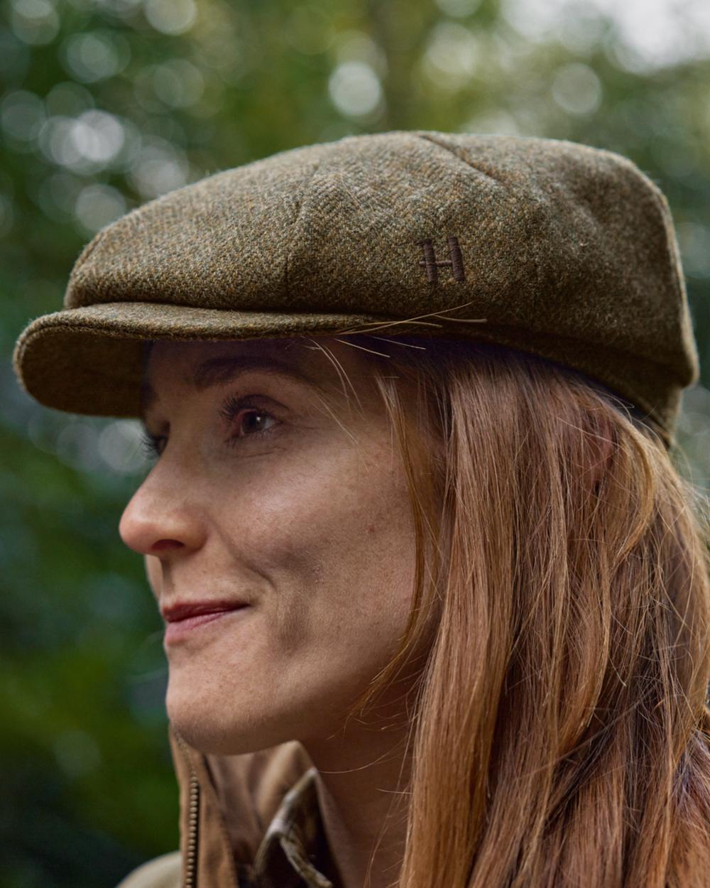 Forest Green Herringbone Coloured Harkila Kenmore Classic Baker Boy Cap on forest background 
