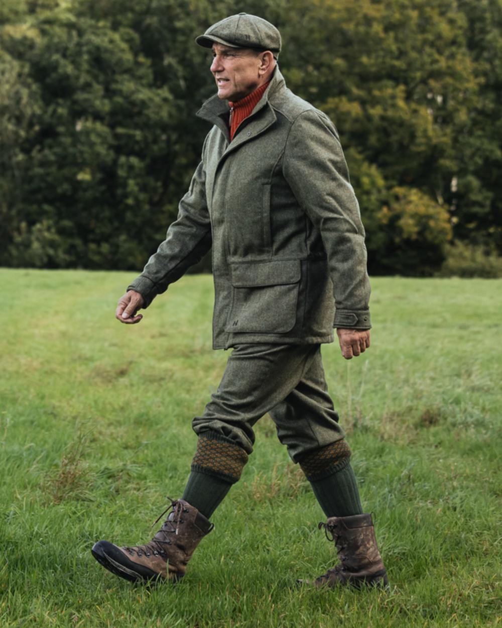 Forest Green Herringbone Coloured Harkila Kenmore GTX Jacket on forest background 