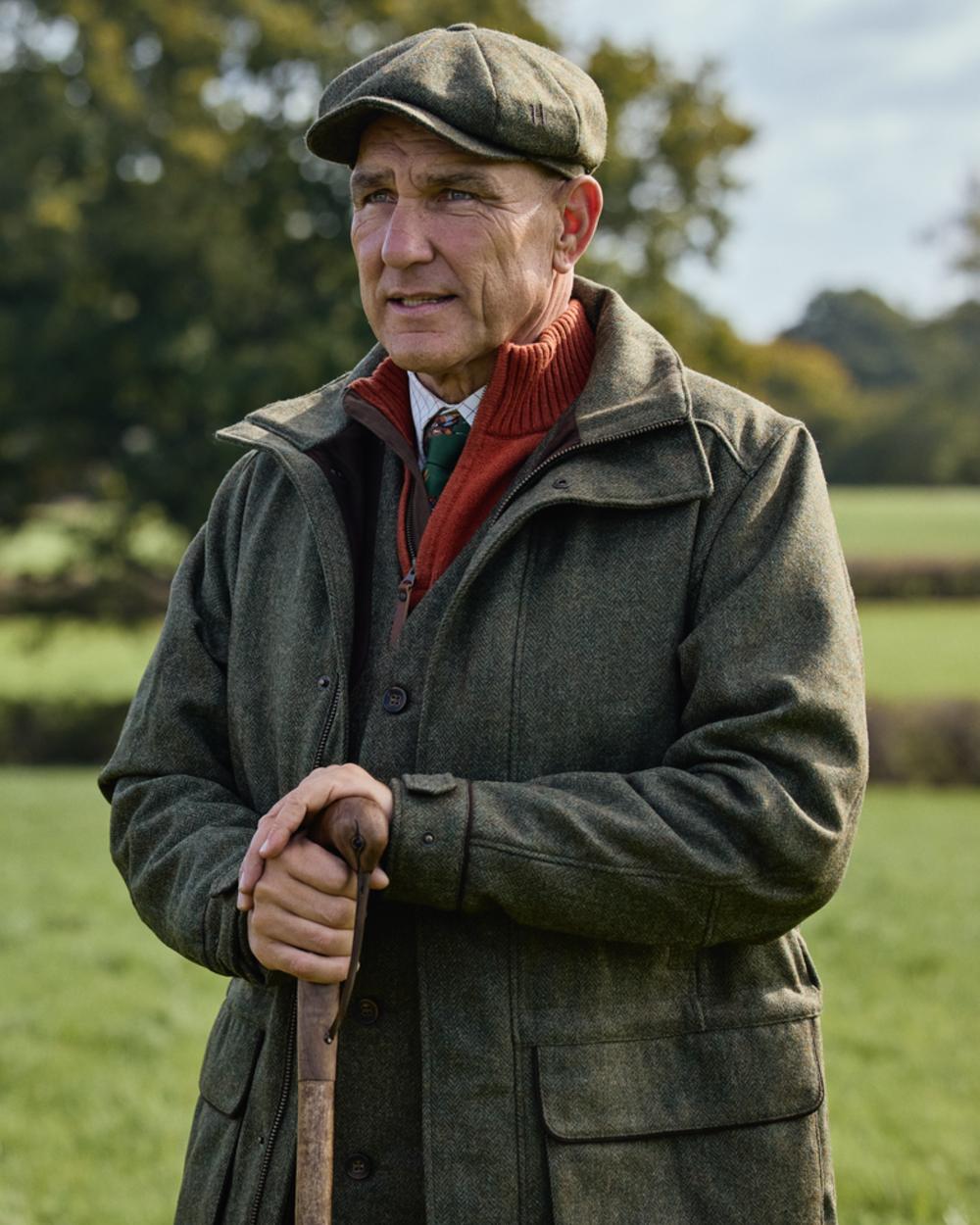 Forest Green Herringbone Coloured Harkila Kenmore GTX Jacket on forest background 