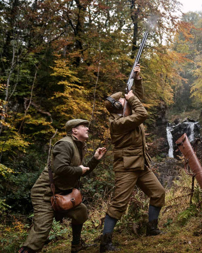 Terragon Brown coloured Harkila Kenmore GTX Jacket on forest background 