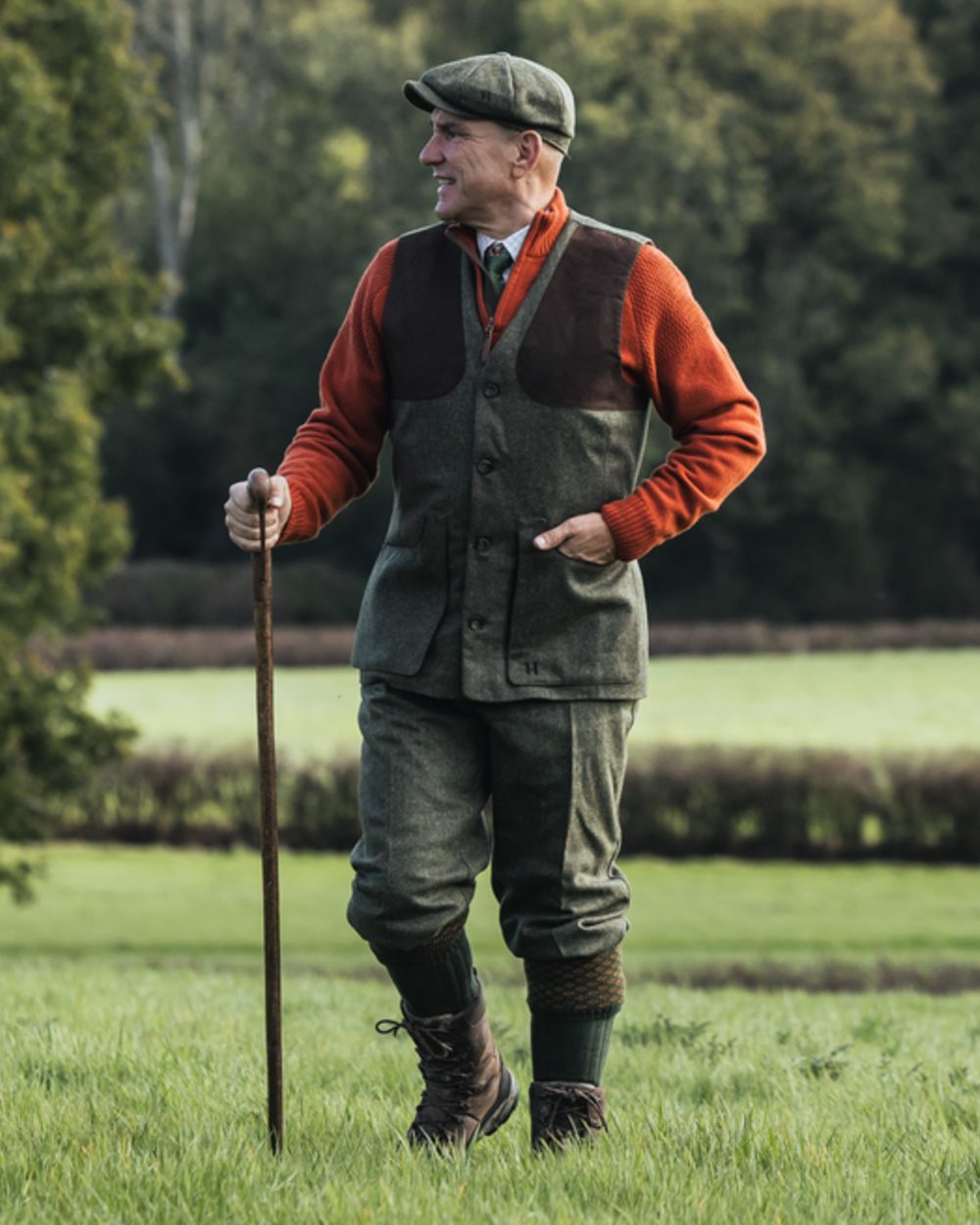 Forest Green Herringbone coloured Harkila Kenmore Shooting Waistcoat on forest background 