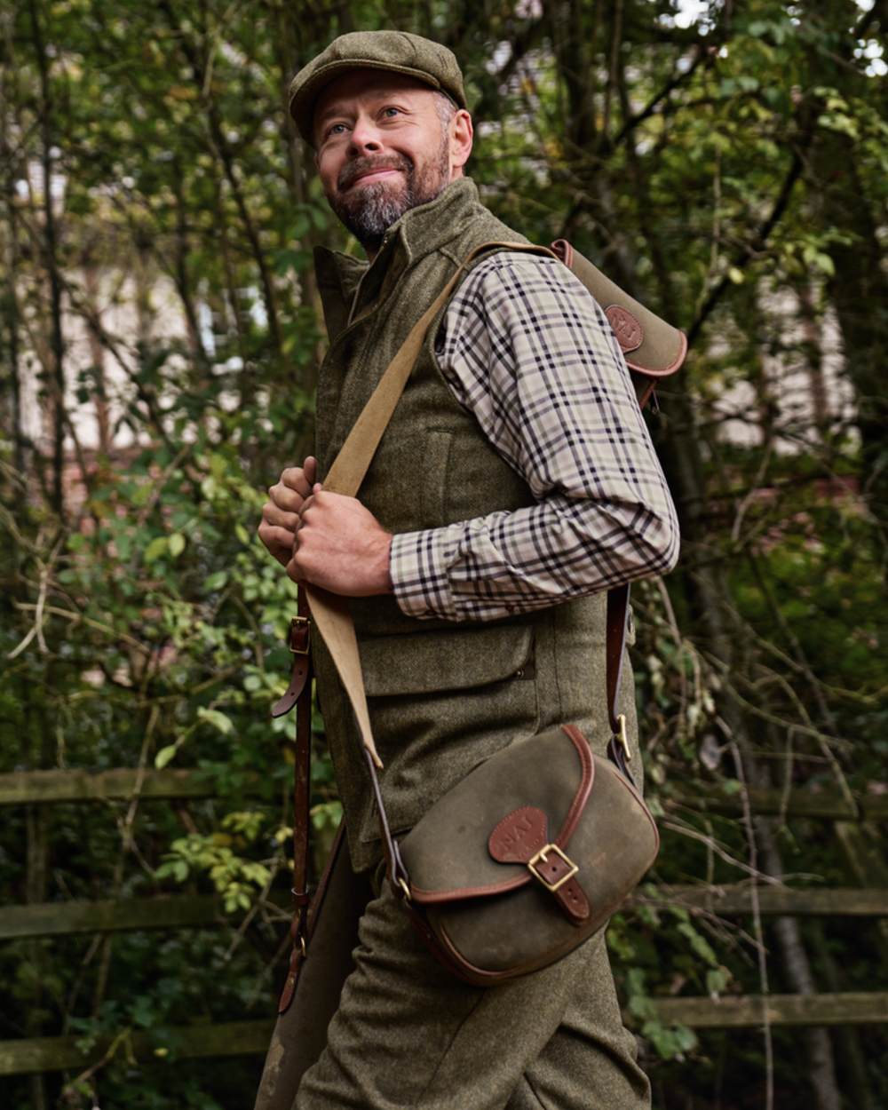 Forest Green Herringbone Coloured Harkila Kenmore Waistcoat on forest background 