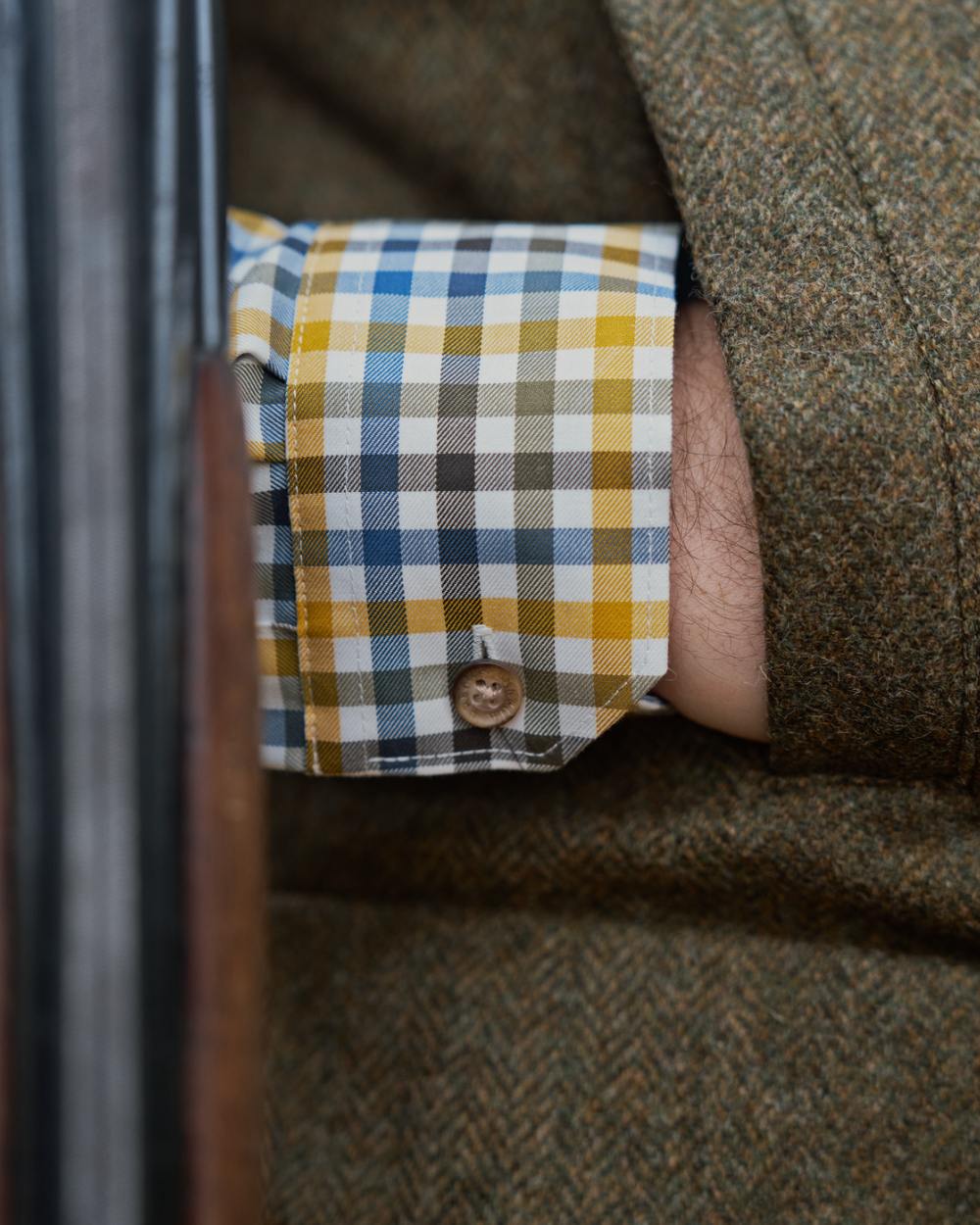 Forest Green Herringbone Coloured Harkila Kenmore Waistcoat on forest background 