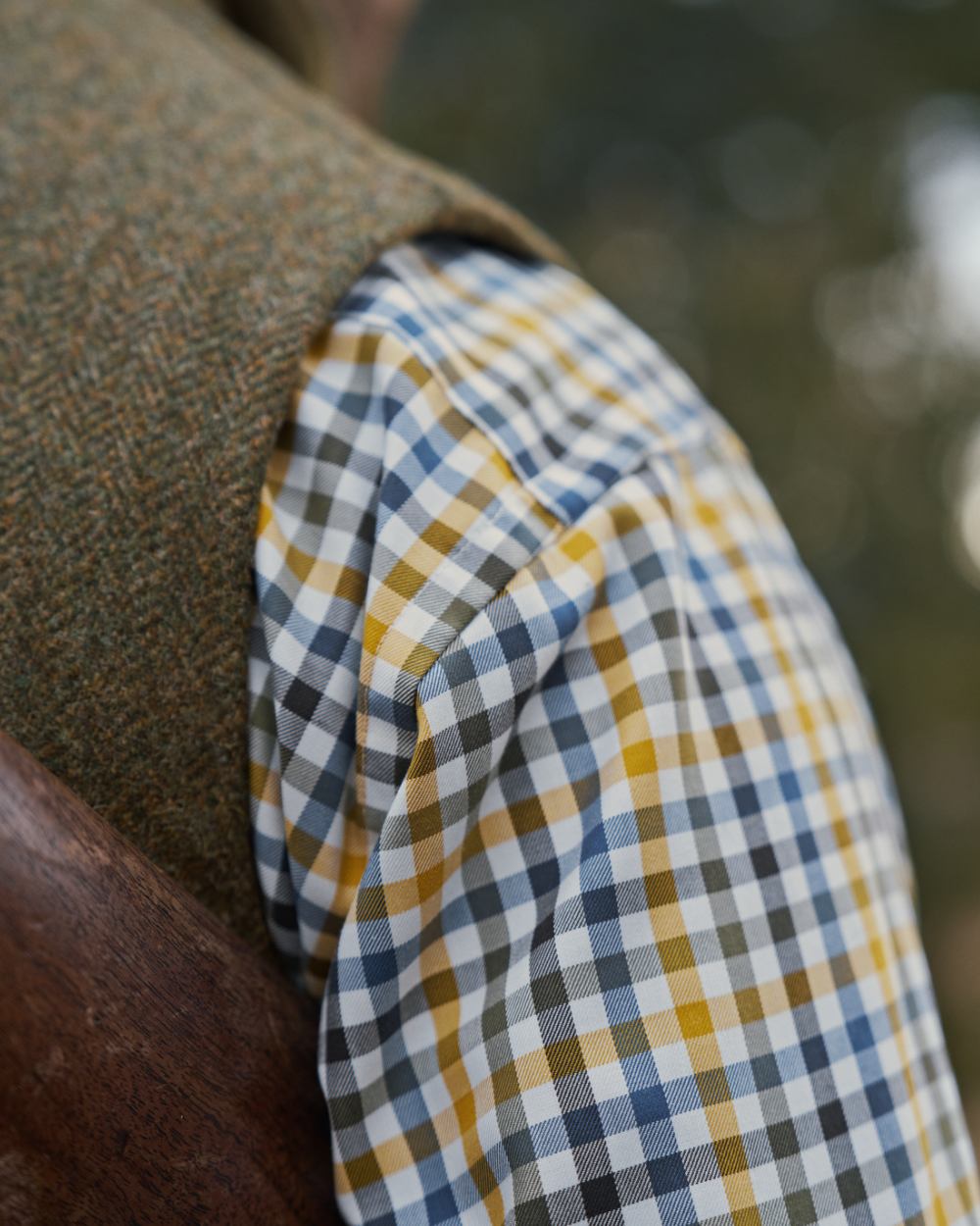 Forest Green Herringbone Coloured Harkila Kenmore Waistcoat on forest background 