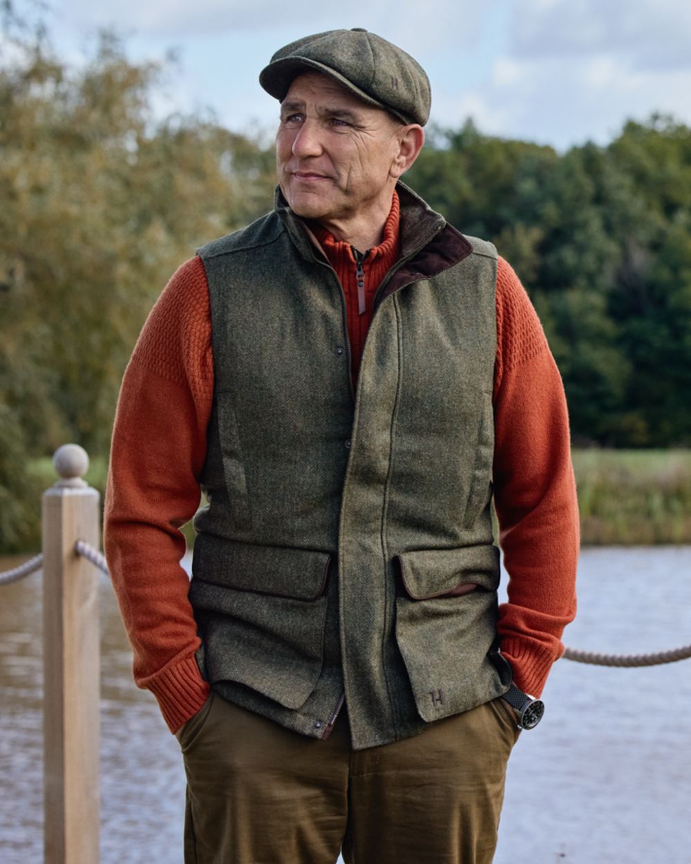 Forest Green Herringbone Coloured Harkila Kenmore Waistcoat on forest background 