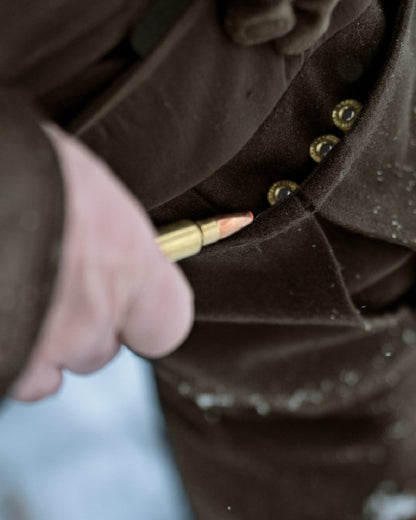 Dark Hunting Green Shadow Brown coloured Harkila Kodiak CleverWool HSP Insulated Trousers on winter background 