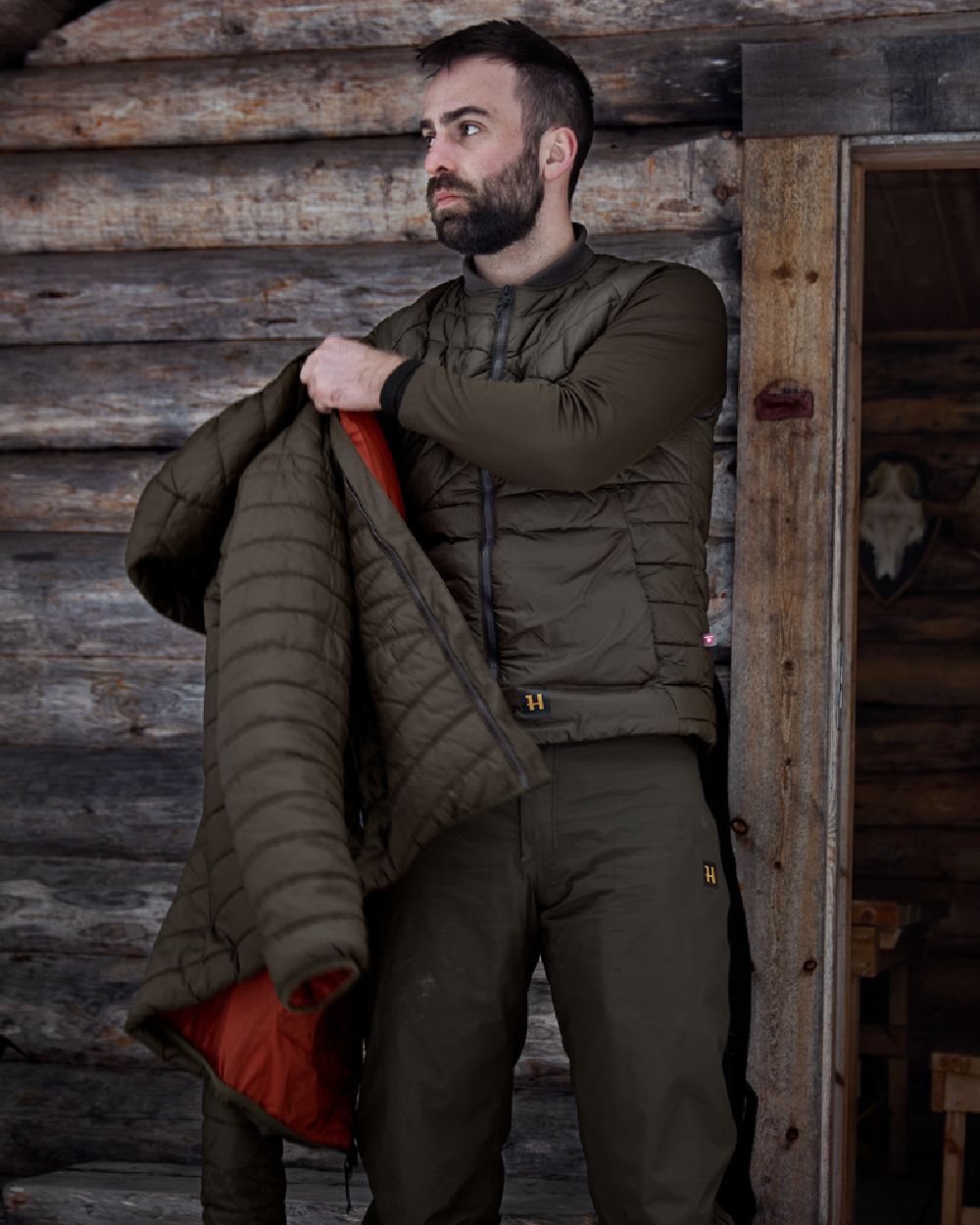 Willow Green Coloured Harkila Logmar Insulated Packable Waistcoat on outdoor background 