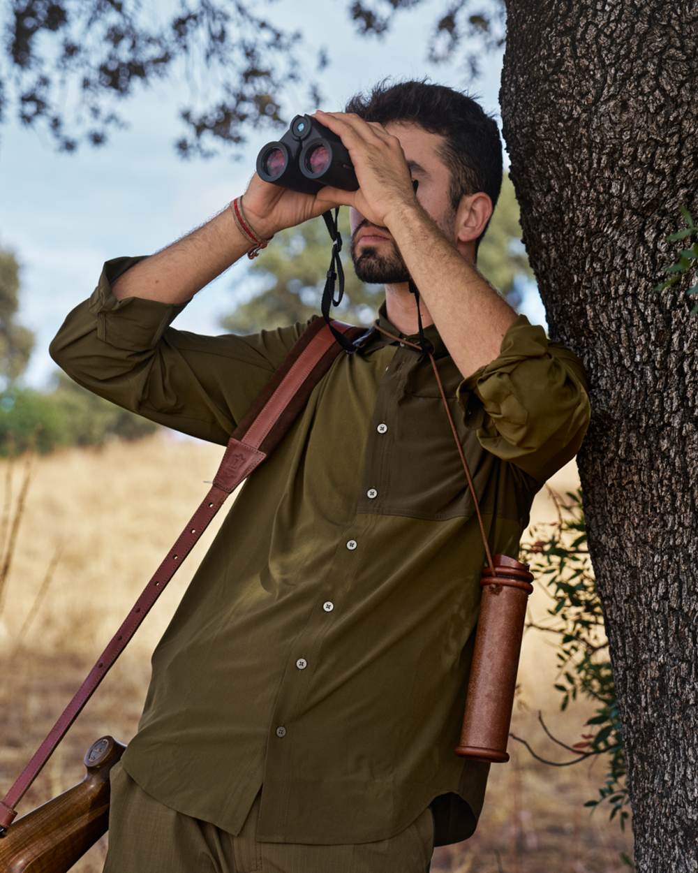 Dark Olive Willow Green Coloured Harkila Kenmore Cl. Flat Cap on forest background 