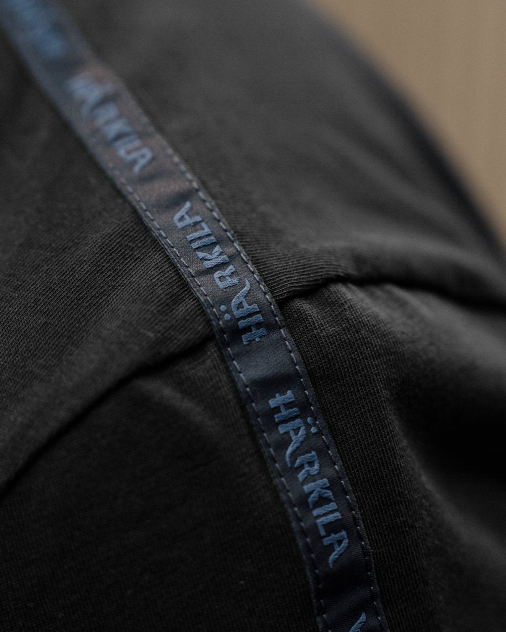 Anthractite/Sea Blue coloured Harkila Logo Band Short Sleeve T-Shirt on outdoor background 