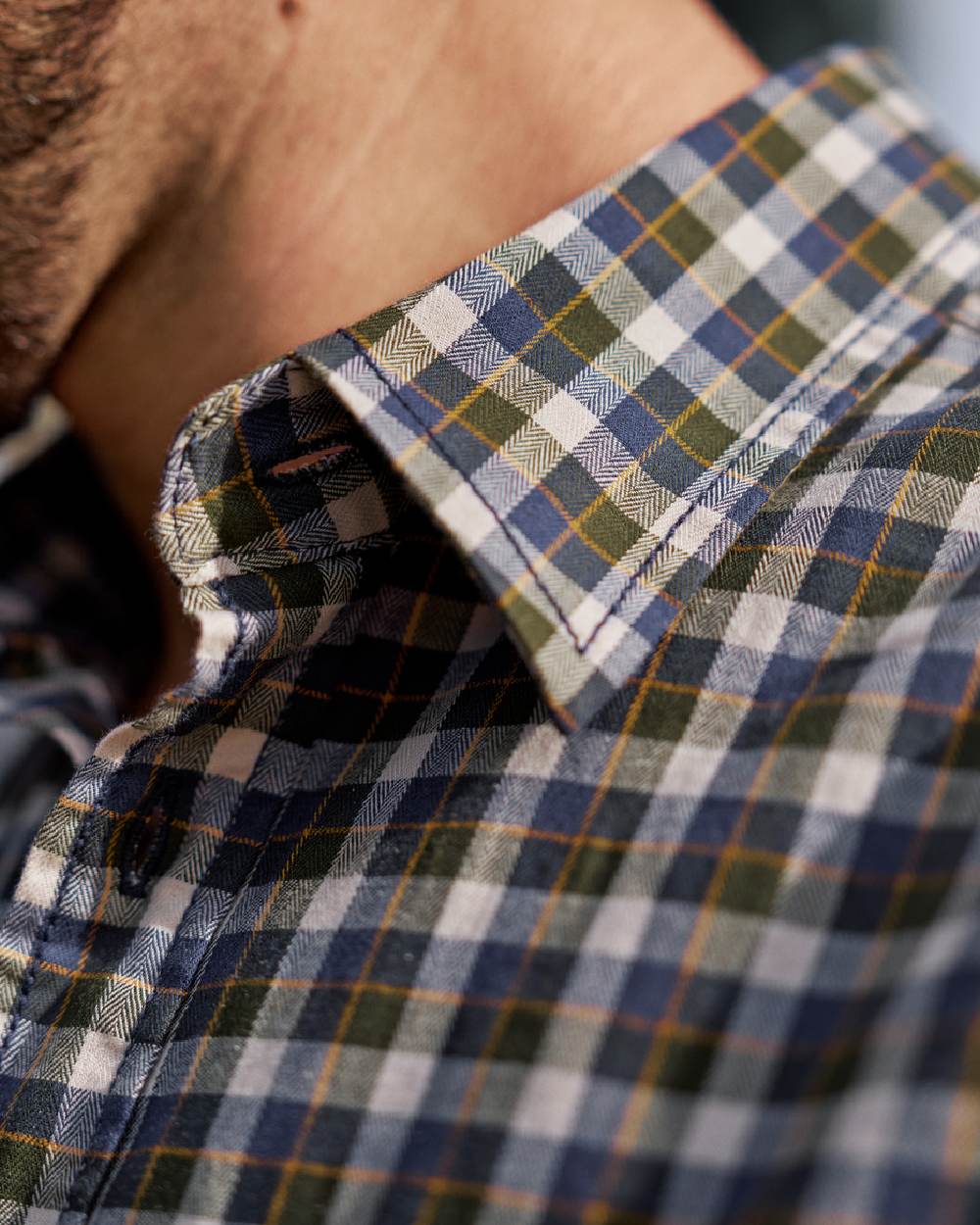 Naval Blue Check Coloured Harkila Mens Fjell Short Sleeve Shirt on blurry background 