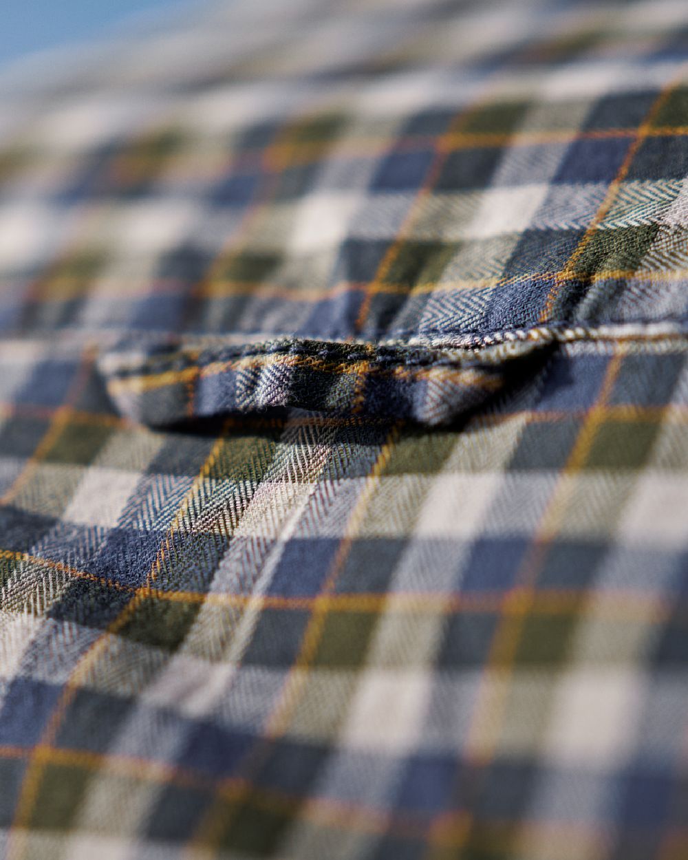 Naval Blue Check Coloured Harkila Mens Fjell Short Sleeve Shirt on blurry background 
