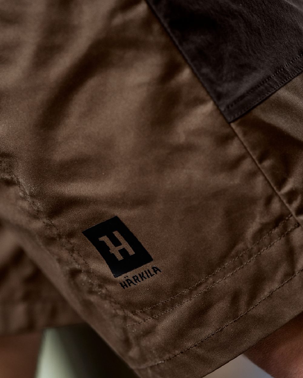Dark Earth Shadow Brown Coloured Harkila Mens Fjell Shorts on studio background 
